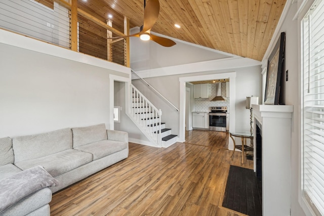 410 Campbell Ave, Tullahoma, TN 37388 - living area featuring wooden ceiling, a fireplace, high vaulted ceiling, a ceiling fan, and stairs