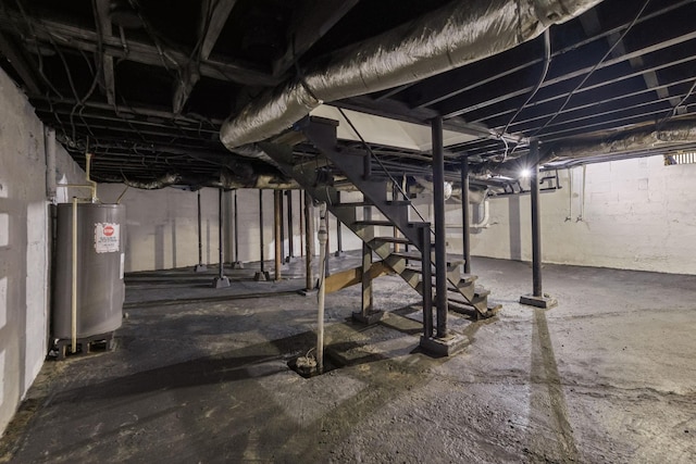 410 Campbell Ave, Tullahoma, TN 37388 - unfinished below grade area with electric water heater and stairway