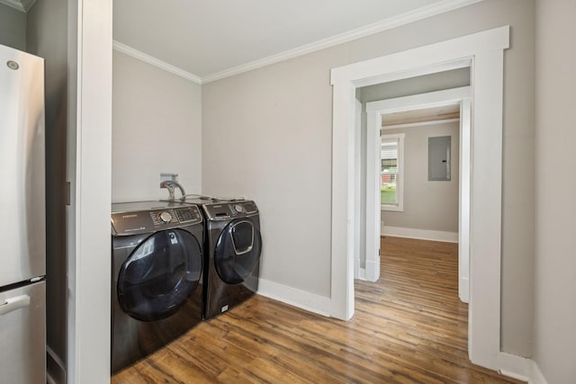 410 Campbell Ave, Tullahoma, TN 37388 - laundry area with independent washer and dryer, crown molding, wood finished floors, and electric panel