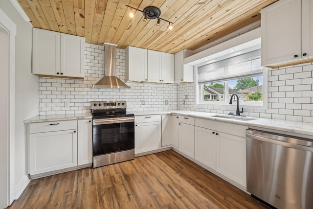 410 Campbell Ave, Tullahoma, TN 37388 - kitchen with appliances with stainless steel finishes, wooden ceiling, wall chimney exhaust hood, decorative backsplash, and white cabinetry