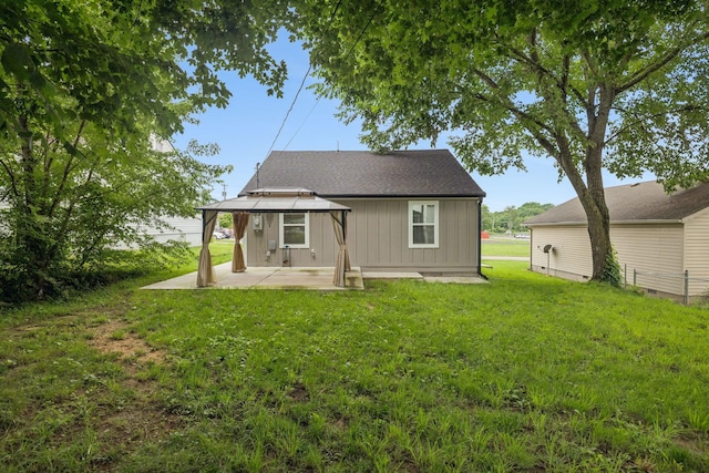 410 Campbell Ave, Tullahoma, TN 37388 - rear view of house with a gazebo, a patio area, a yard, and board and batten siding