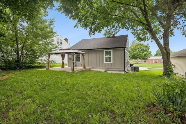 410 Campbell Ave, Tullahoma, TN 37388 - rear view of house with a gazebo, board and batten siding, a lawn, a patio area, and a shingled roof