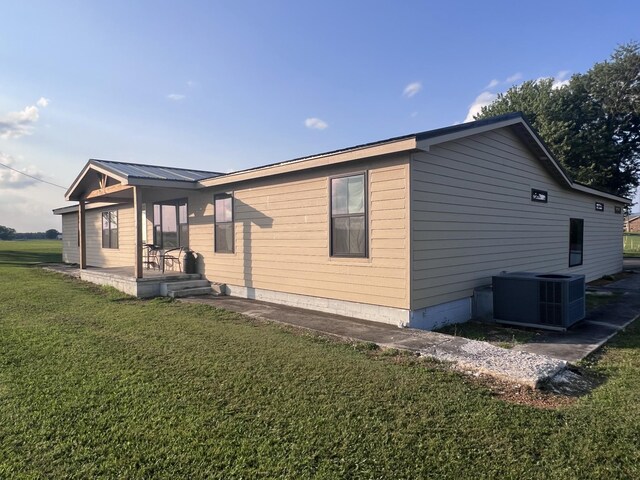 11 Jess Long Ln, Hillsboro, TN 37342 - view of side of property with a yard and a central AC unit