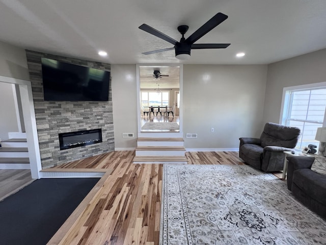 11 Jess Long Ln, Hillsboro, TN 37342 - living room with a fireplace, wood finished floors, a ceiling fan, and recessed lighting