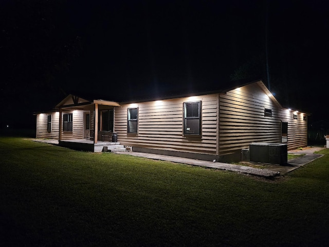 11 Jess Long Ln, Hillsboro, TN 37342 - back of house at night with a yard and a porch