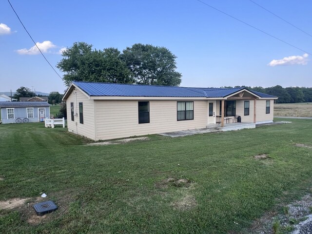 11 Jess Long Ln, Hillsboro, TN 37342 - view of front of house with a front lawn, a metal roof, and covered porch