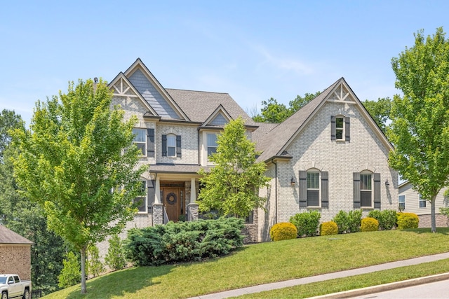 6826 Falls Ridge Ln, College Grove, TN 37046 - craftsman house with a front yard, brick siding, and a shingled roof