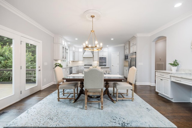 6826 Falls Ridge Ln, College Grove, TN 37046 - dining area featuring a chandelier, crown molding, recessed lighting, arched walkways, and dark wood finished floors