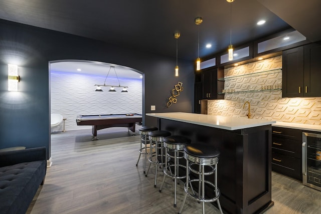 6826 Falls Ridge Ln, College Grove, TN 37046 - bar area featuring beverage cooler, dark wood-style floors, pool table, decorative backsplash, and decorative light fixtures