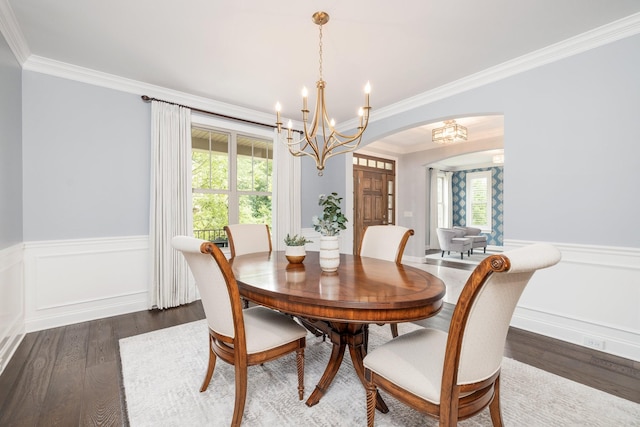 6826 Falls Ridge Ln, College Grove, TN 37046 - dining space featuring a chandelier, arched walkways, ornamental molding, wainscoting, and dark wood-style floors