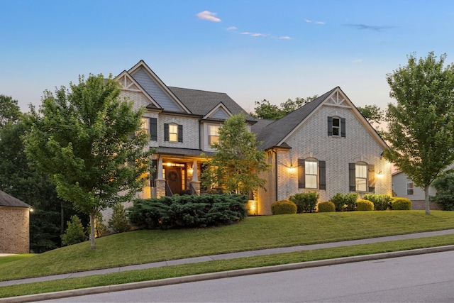 6826 Falls Ridge Ln, College Grove, TN 37046 - craftsman-style house with a lawn and brick siding
