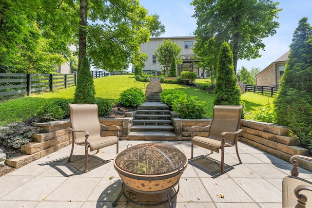 6826 Falls Ridge Ln, College Grove, TN 37046 - fenced backyard featuring a patio, an outdoor fire pit, and stairway