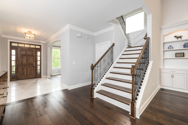 6826 Falls Ridge Ln, College Grove, TN 37046 - entryway with arched walkways, stairway, hardwood / wood-style flooring, and ornamental molding