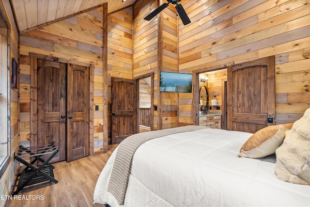 201 Laurel Oaks Way, Gatlinburg, TN 37738 - bedroom featuring wooden walls, lofted ceiling, light wood-type flooring, and wooden ceiling