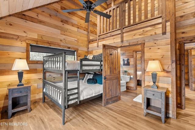 201 Laurel Oaks Way, Gatlinburg, TN 37738 - bedroom featuring wood walls, wood finished floors, and lofted ceiling