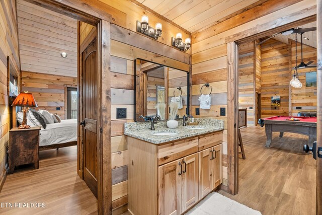 201 Laurel Oaks Way, Gatlinburg, TN 37738 - kitchen featuring wood walls, pool table, light wood-type flooring, light stone countertops, and wood ceiling