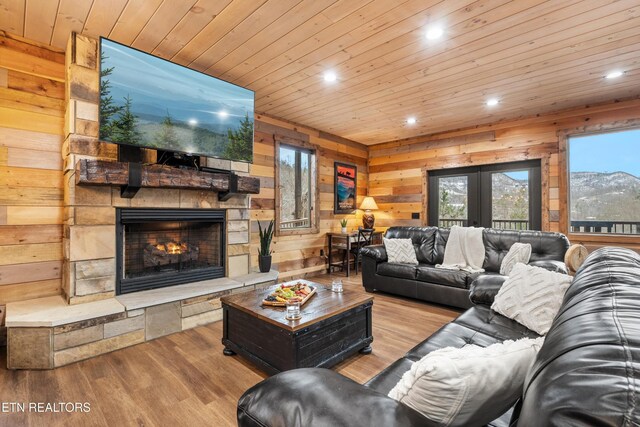 201 Laurel Oaks Way, Gatlinburg, TN 37738 - living area featuring recessed lighting, a fireplace, wooden walls, healthy amount of natural light, and wood finished floors