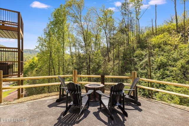 201 Laurel Oaks Way, Gatlinburg, TN 37738 - view of patio / terrace featuring a fire pit and a view of trees
