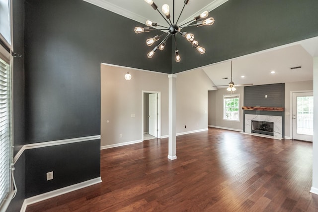 102 Buckhaven Ct, Hendersonville, TN 37075 - unfurnished living room with a fireplace, wood finished floors, a chandelier, a ceiling fan, and ornamental molding