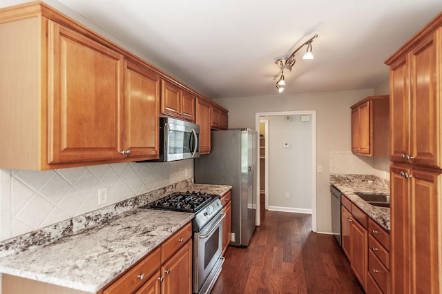 102 Buckhaven Ct, Hendersonville, TN 37075 - kitchen with stainless steel appliances, dark wood finished floors, light stone counters, tasteful backsplash, and brown cabinetry