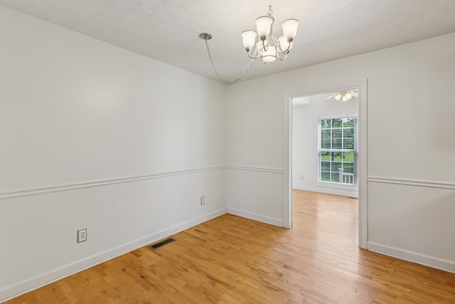 209 Taylor Creek Ln, Chapel Hill, TN 37034 - unfurnished room with a chandelier and light wood-style flooring