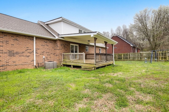 458 Robins Trl, Westmoreland, TN 37186 - rear view of property with brick siding, a wooden deck, and roof with shingles