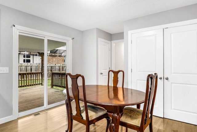 458 Robins Trl, Westmoreland, TN 37186 - dining room featuring light wood-type flooring and baseboards
