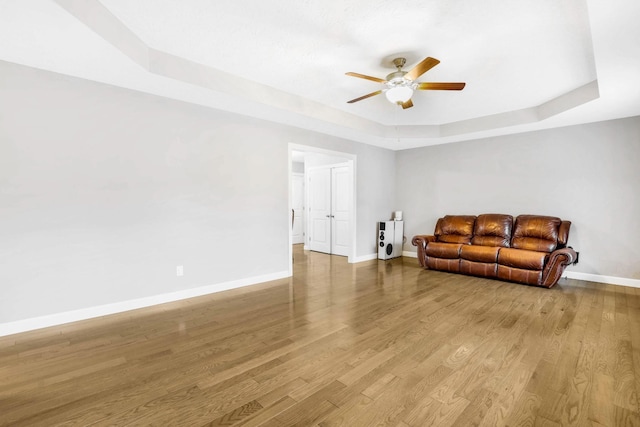 458 Robins Trl, Westmoreland, TN 37186 - sitting room featuring a raised ceiling, a ceiling fan, and wood finished floors