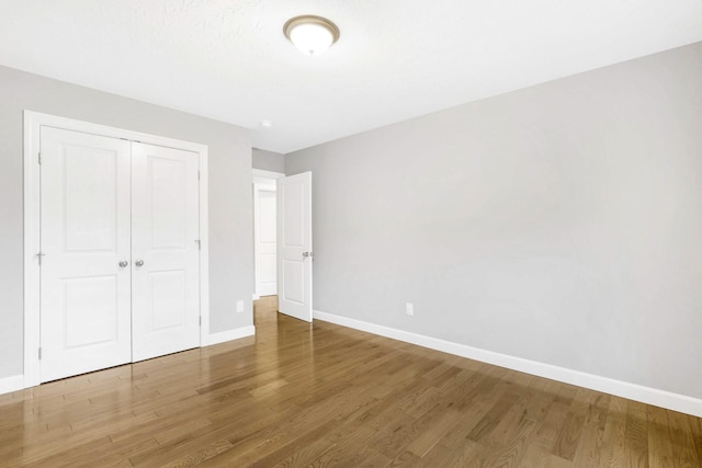 458 Robins Trl, Westmoreland, TN 37186 - unfurnished bedroom with wood finished floors and a closet