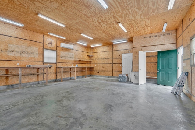 308 Custer Ct, Smyrna, TN 37167 - garage with an AC wall unit and a workshop area