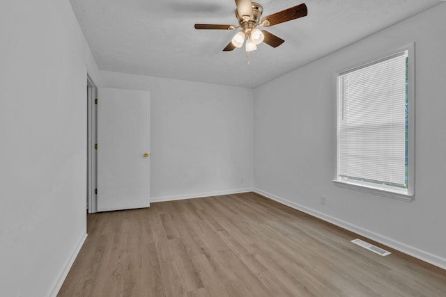 308 Custer Ct, Smyrna, TN 37167 - spare room featuring wood finished floors, ceiling fan, healthy amount of natural light, and a textured ceiling