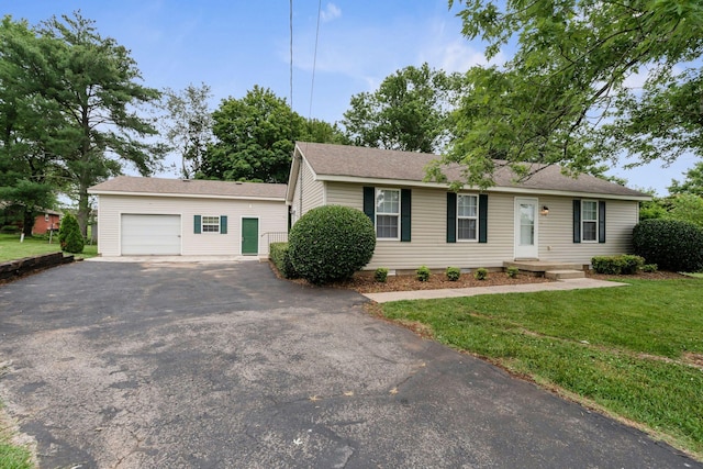 308 Custer Ct, Smyrna, TN 37167 - ranch-style house with asphalt driveway, an attached garage, a front yard, and roof with shingles