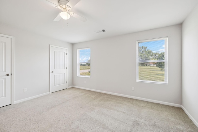130 Grayson Cir, Chapel Hill, TN 37034 - unfurnished bedroom with multiple windows, light carpet, and ceiling fan