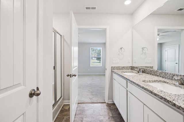 130 Grayson Cir, Chapel Hill, TN 37034 - bathroom with a stall shower, double vanity, a ceiling fan, and stone finish floors
