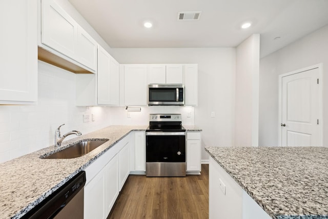 130 Grayson Cir, Chapel Hill, TN 37034 - kitchen featuring stainless steel appliances, white cabinetry, and recessed lighting