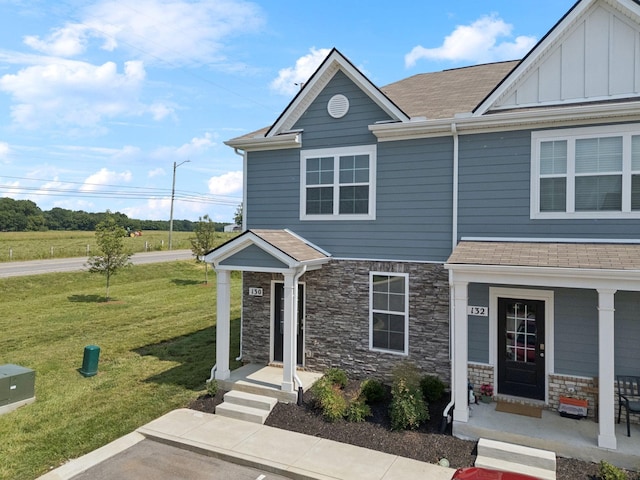 130 Grayson Cir, Chapel Hill, TN 37034 - view of front of house with a front yard, stone siding, roof with shingles, and board and batten siding