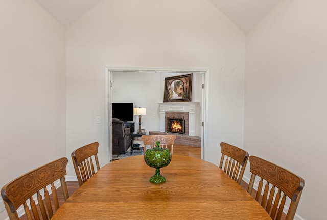 123 River Downs Blvd, Murfreesboro, TN 37128 - dining room featuring a brick fireplace and high vaulted ceiling