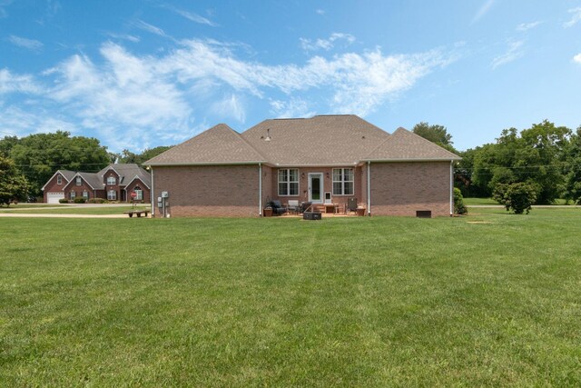 123 River Downs Blvd, Murfreesboro, TN 37128 - back of house featuring a lawn, brick siding, and a shingled roof