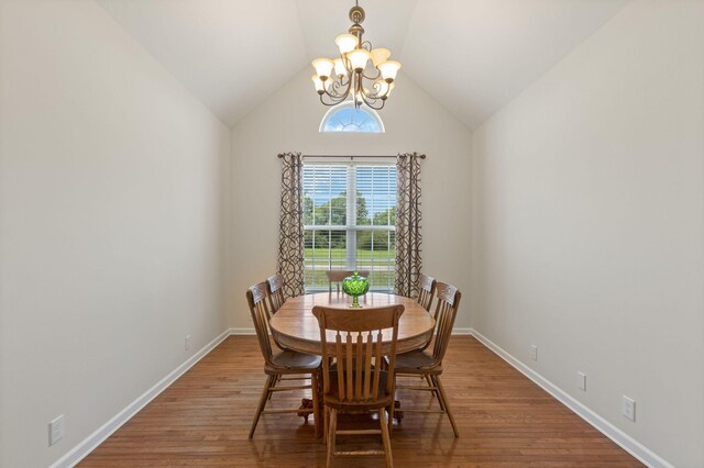 123 River Downs Blvd, Murfreesboro, TN 37128 - dining room with a chandelier, wood finished floors, and vaulted ceiling