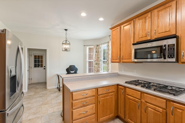 123 River Downs Blvd, Murfreesboro, TN 37128 - kitchen featuring stainless steel appliances, recessed lighting, a peninsula, brown cabinetry, and light countertops