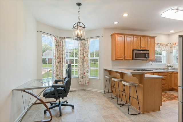 123 River Downs Blvd, Murfreesboro, TN 37128 - kitchen featuring stainless steel appliances, light countertops, a kitchen breakfast bar, a chandelier, and recessed lighting