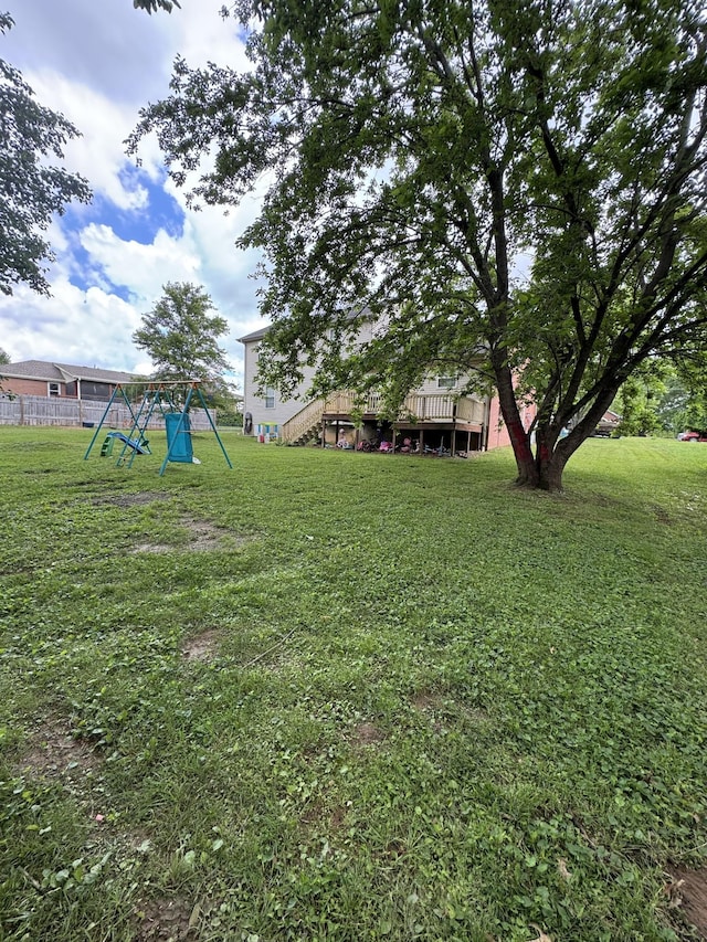1114 Lea Cir, Lebanon, TN 37087 - view of green lawn with a playground and a wooden deck
