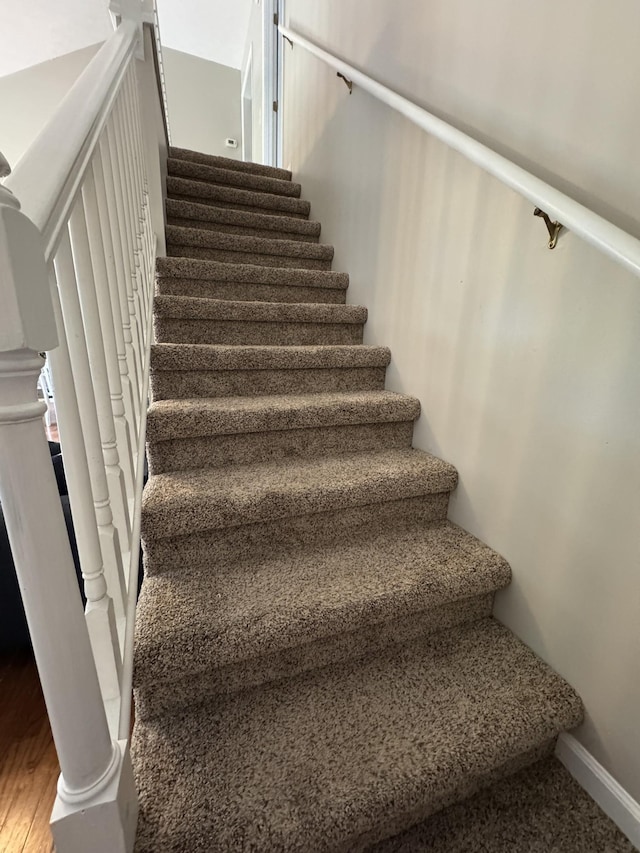 1114 Lea Cir, Lebanon, TN 37087 - stairs with baseboards and wood finished floors