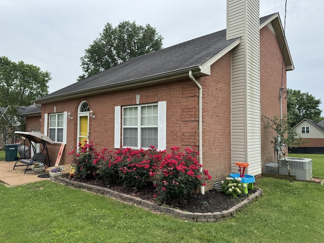 1114 Lea Cir, Lebanon, TN 37087 - view of property exterior featuring a chimney, a lawn, and brick siding