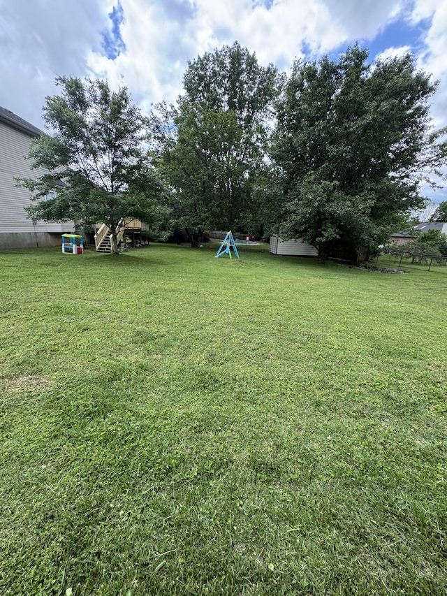 1114 Lea Cir, Lebanon, TN 37087 - view of green lawn with a shed