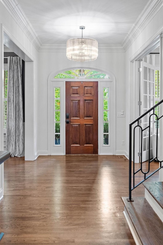 104 Majestic Ln, Franklin, TN 37064 - foyer featuring wood finished floors, a chandelier, and ornamental molding