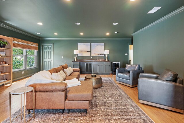 104 Majestic Ln, Franklin, TN 37064 - living area featuring crown molding, recessed lighting, light wood-style floors, and beverage cooler