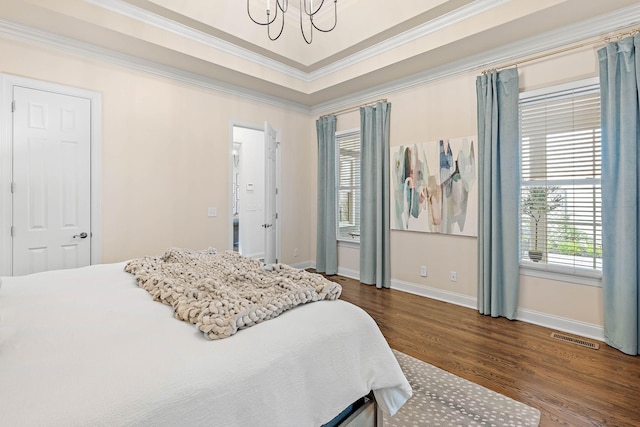 104 Majestic Ln, Franklin, TN 37064 - bedroom featuring crown molding, wood finished floors, a chandelier, and a raised ceiling