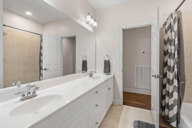 104 Majestic Ln, Franklin, TN 37064 - bathroom featuring double vanity and tile patterned floors