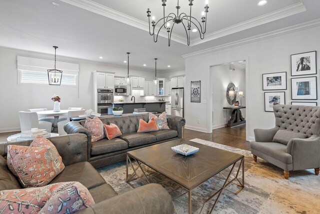 104 Majestic Ln, Franklin, TN 37064 - living room featuring a chandelier, wood finished floors, crown molding, and recessed lighting